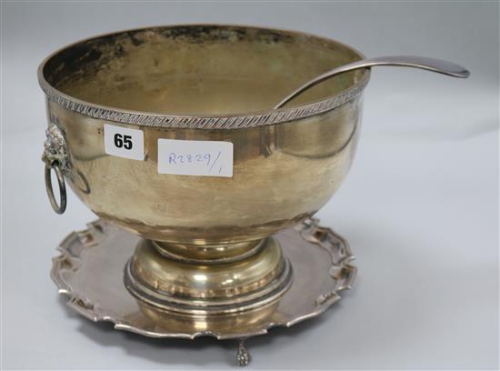 A silver plated bowl, ladle and stand